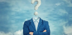 Persona con traje azul y brazos cruzados, sin cabeza visible; sobre el cuello aparece un signo de interrogación formado por nubes.